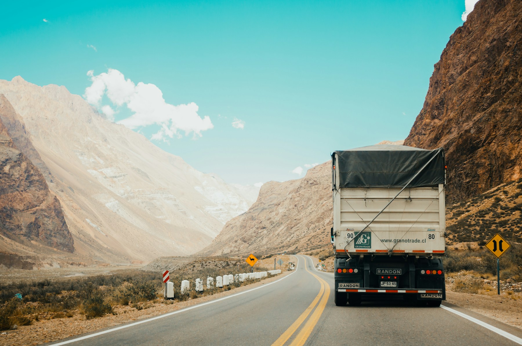 Freight truck travelling along a road